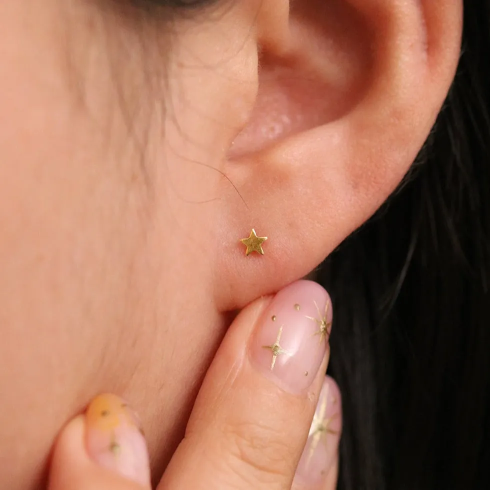 Tiny star stud earrings