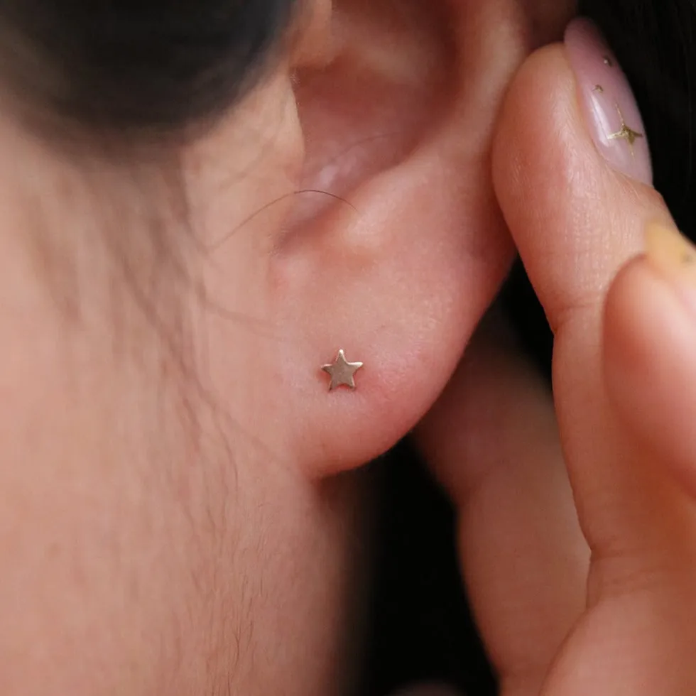 Tiny star stud earrings